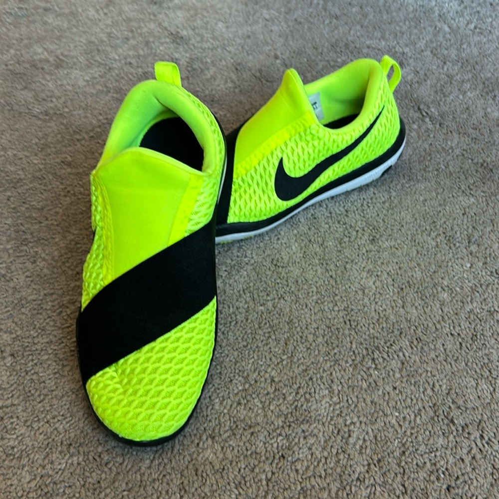 Neon yellow Nike slip on sneakers